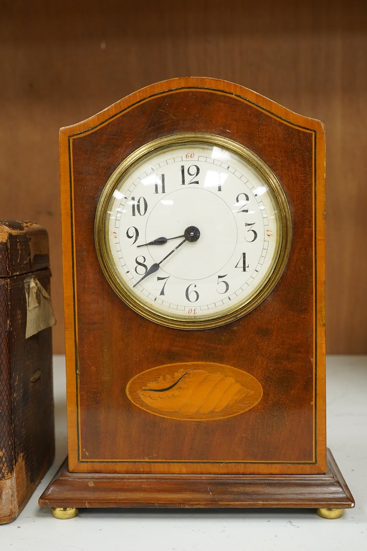 A late 19th century lacquered brass repeating carriage clock, by Henri Jacot and an Edwardian inlaid mantel timepiece with key, largest 23cm high